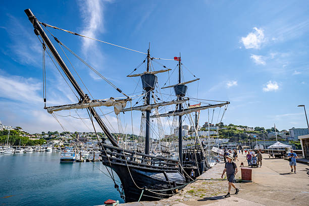 Whitby, North Yorkshire, UK July 11 2024, The replica Galeon Andalucia, a 16th- 17thC galleon berthed in the fishing port of Whitby, North Yorkshire beside small fishing boats.    Space for copy.