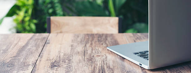 istock Desk for student concept. Desktop Laptop Computer for study for exam place on School table for student work online at home-banner image. 2219655861