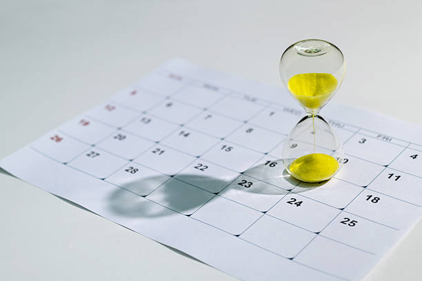istock Calendar and hourglass on the table 2219657828