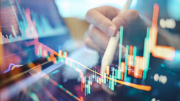 istock Hands using smartphone futuristic mobile trading app real-time financial market trends forex and stock chart overlays symbolizing fintech and business innovation 2219658317