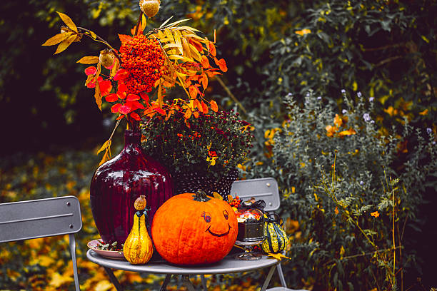 autumn decoration for halloween with pumpkins and skeletons