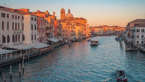 istock Boat in a canal in Venice at sunset 2219660876