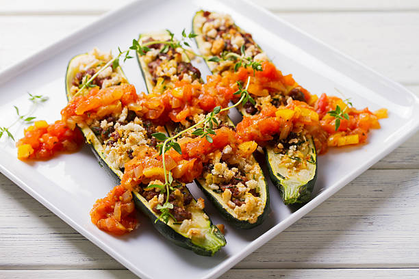 Zucchini stuffed with minced beef on plate. Zucchini boats. Loaded courgettes