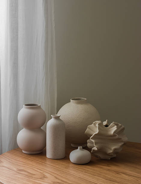 istock A variety of ceramic vases on a wooden table 2219663813