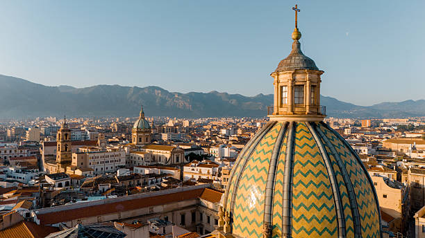 Vibrant Tiled Dome over Palermo Rooftops stock photo