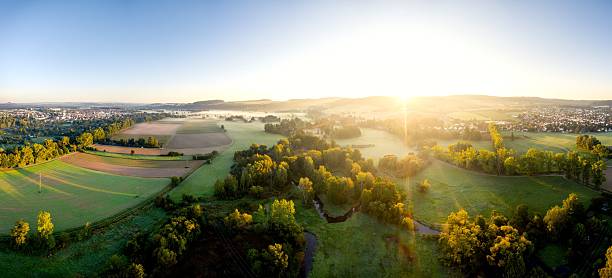 istock Aerial sunrise over lush countryside landscape 2219666461