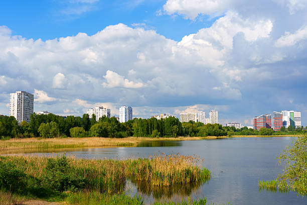 istock Scenic View of Kyiv Lake Surrounded by Modern Architecture 2219666775
