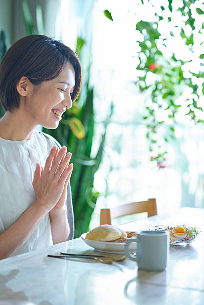 A woman eating breakfast in the room