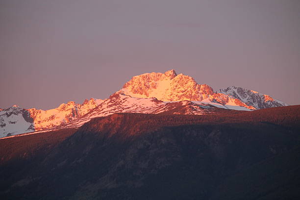 istock Sunset on the snow capped mountain top 2219672035