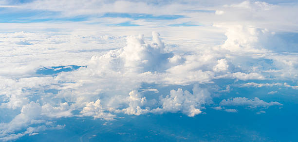 istock Blue sky with clouds in the sky. Sky clouds background. White cloudy Heaven with soft sun light. Clouds on pastel blue sky background. 2219672089