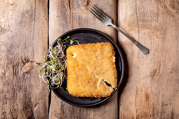 istock Golden Cheese Cutlet Black Plate Wooden 2219672567