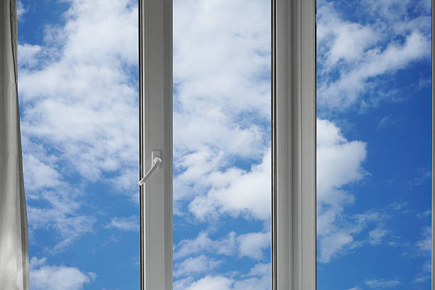 istock View from the window of a blue sky with white clouds. 2219673311