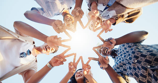 istock Star hands, circle and group of people with community, collaboration or teamwork for volunteering. Gathering, peace and friends with fingers together for synergy, solidarity or bonding from low angle 2219674109