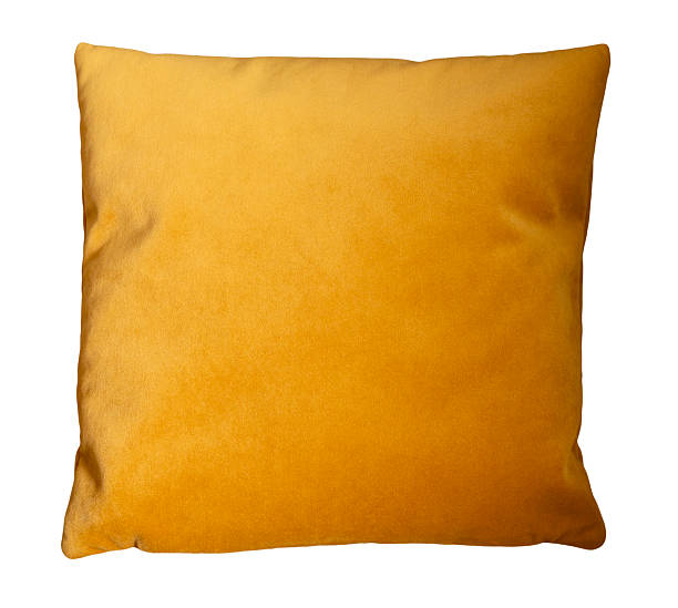 istock Bright yellow pillow isolated on white background, offering a stylish touch to interior decor. Ideal for living rooms, bedrooms, or as a decorative accent piece. Top view, cut out cushion. 2219674433