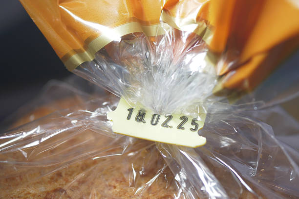 istock Date marked on a packaged loaf of bread in plastic wrap 2219674477