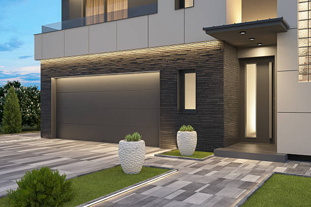 istock Modern Luxury Villa with Illuminated Pathway at Dusk 2219675935