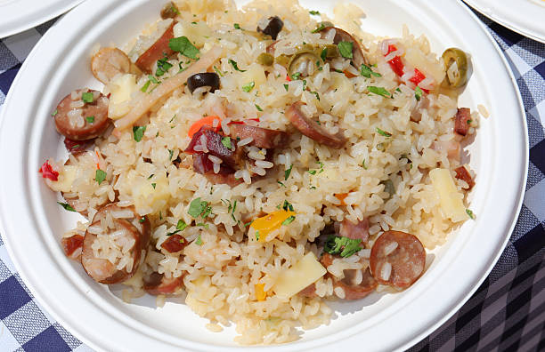 plate full of rice salad a typical European summer dish with sausage vegetables and cheese