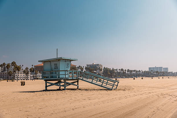 istock Empty Sandy Beach with Iconic Blue Lifeguard Hut 2219678446