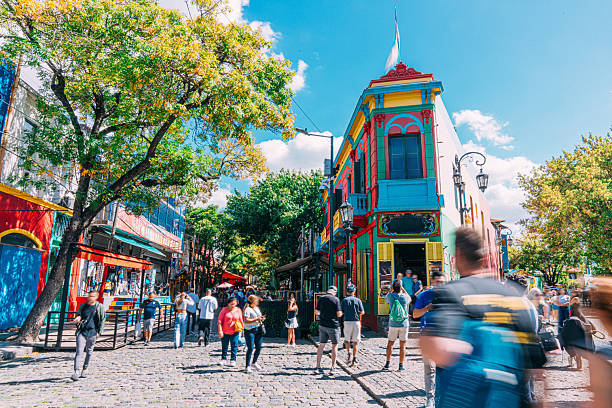 Vibrant Colored Buildings and Tourists in La Boca, Buenos Aires, Argentina A Wide Angle View of Tourists visiting the Vibrant-Colored Houses and Businesses in La Boca, Buenos Aires, Argentina.
Many ship-building residents built homes from leftover ship materials and paint, creating mismatched textures and patchwork style. buenos-aires stock pictures, royalty-free photos & images