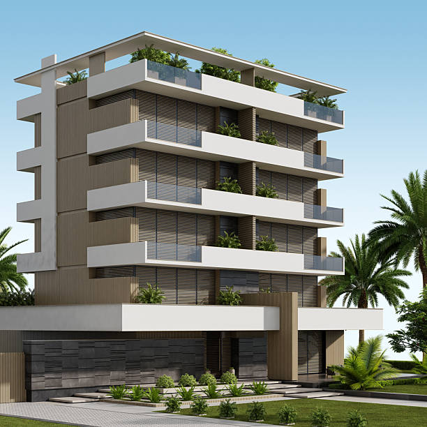 A contemporary low-rise apartment building in beige tones, designed with clean lines and a minimalist aesthetic. The front-facing terraces are spacious and modern, finished in white with sleek glass railings that enhance the open, airy feel. Each terrace is richly adorned with greenery—plants, shrubs, and small trees—creating a vibrant contrast against the neutral facade and emphasizing the building’s eco-friendly and stylish character.The front yard includes a well-maintained garden with lush grass, ornamental plants, and pathway elements that contribute to the overall elegance of the scene. Bathed in natural daylight, the image captures the freshness, modernity, and livability of this urban residential space.