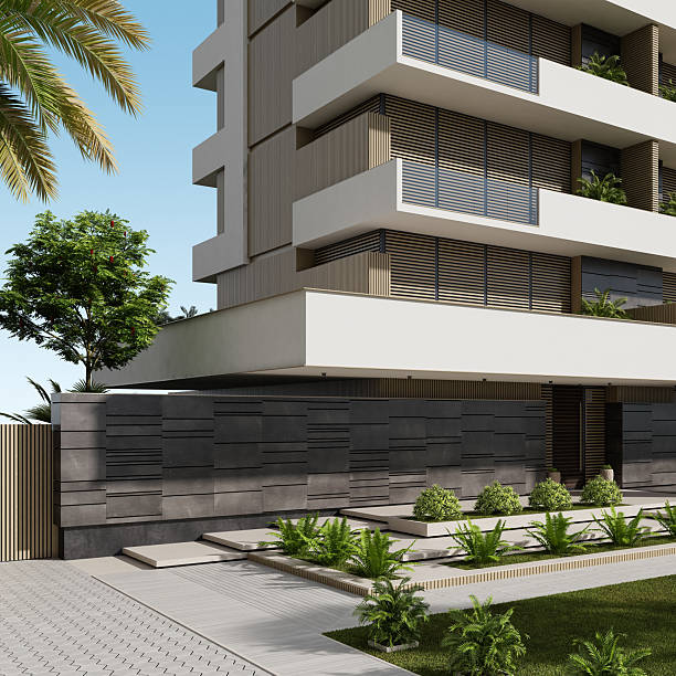 istock Modern Beige Apartment Building with Large White Terraces and Lush Greenery 2219683286