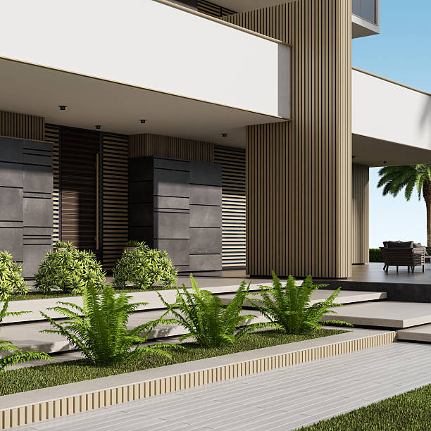 istock Modern Beige Apartment Building with Large White Terraces and Lush Greenery 2219683314