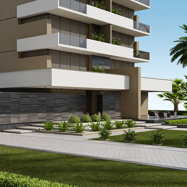 istock Modern Beige Apartment Building with Large White Terraces and Lush Greenery 2219683341