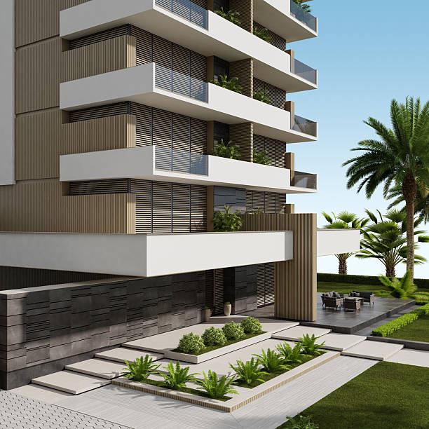 istock Modern Beige Apartment Building with Large White Terraces and Lush Greenery 2219683383