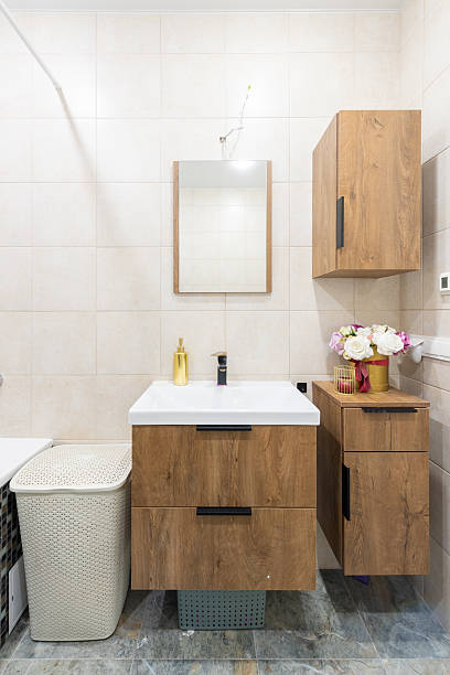 istock Modern Home Bathroom Interior With Wooden Vanity and Floral Decor Elements 2219683884