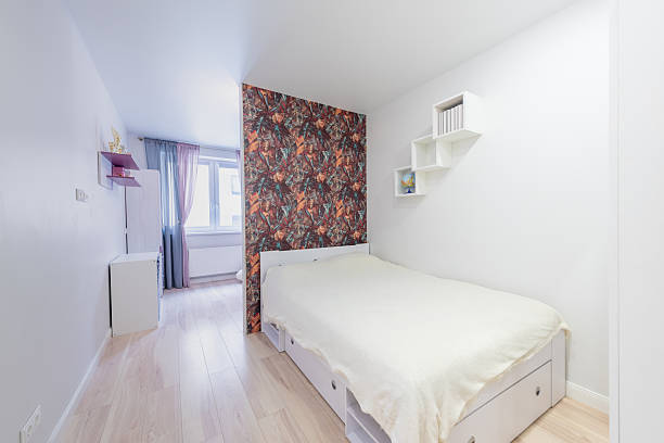 King size bed and a wardrobe next to it.