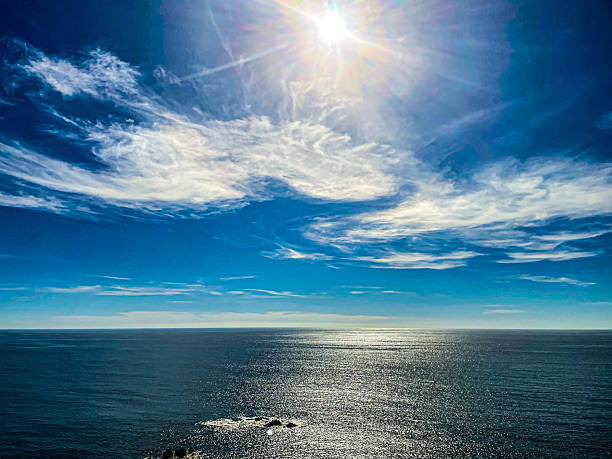 istock Bright Sunburst Over Vast Blue Ocean and Sky 2219684221