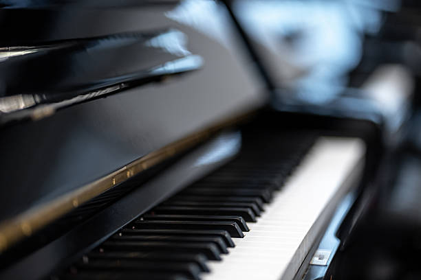 istock Shiny black piano keys waiting to be played 2219686403