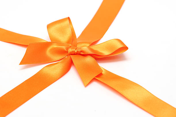istock Orange ribbon isolated on a white background. 2219688171