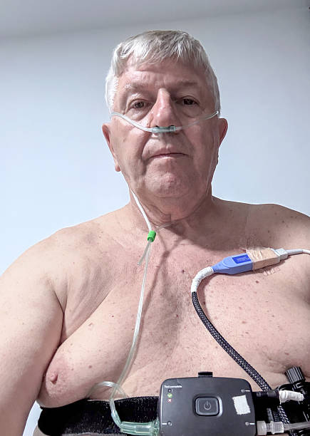 Senior man fitted with sleep apnoea equipment