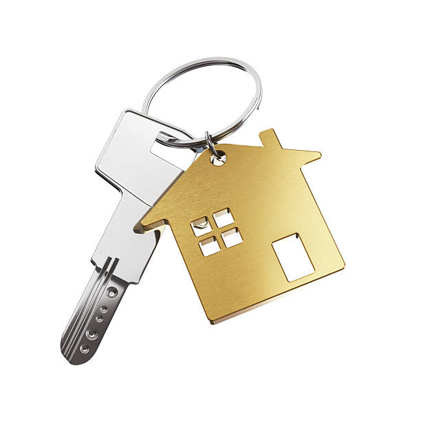 istock Metallic House Keys on Yellow House Shaped Keychain on White Isolated Background, Object Clipping Path 2219693585