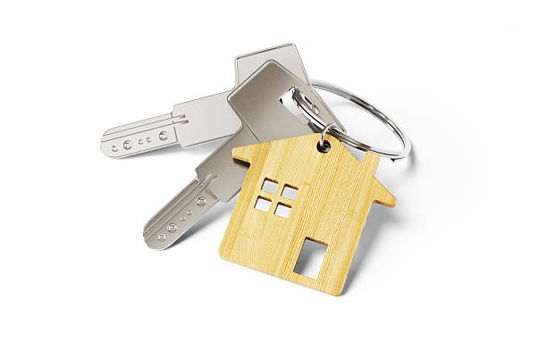 istock Metallic House Keys on Wooden Shaped Keychain on White Isolated Background, Object + Shadow Clipping Path 2219693617