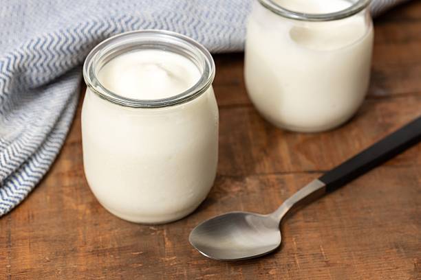 istock Glass jars of yogurt 2219702654