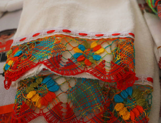istock Colorful handmade embroidery and lace on fabric. Bilro bobbin lace making. 2219703113