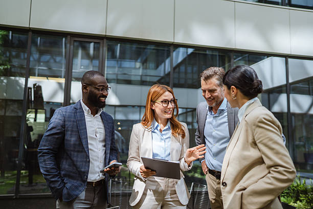 istock multiracial businesspeople review reports with business data charts 2219704063
