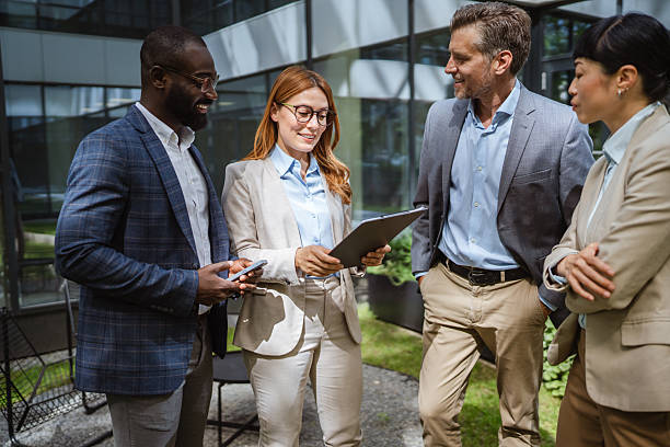 istock multiracial businesspeople review reports with business data charts 2219704368