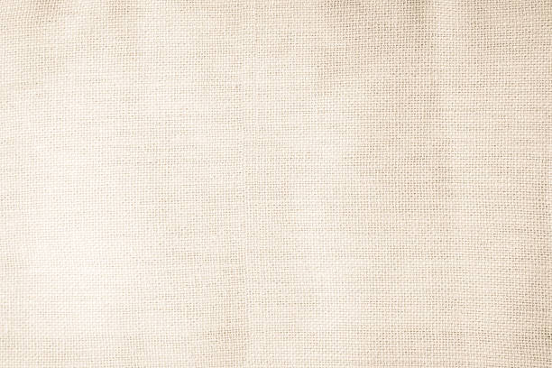 istock Brown sackcloth woven texture background in natural pattern. Jute hessian burlap, linen background in light beige cream color blank. Weaving canvas fiber line cotton cloth textured as organic. 2219706292