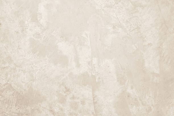 Colour old concrete wall texture background. Close up retro plain cream color cement wall background texture. Design paper vintage parchment element.