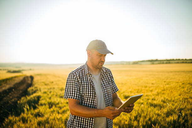 istock Farmer using digital tablet in agriculture field. 2219706930