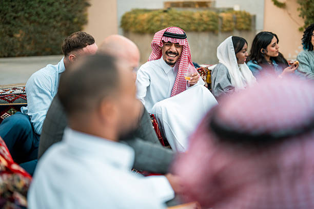 istock Diverse Group Enjoying Conversations in Arabian Majlis 2219707191