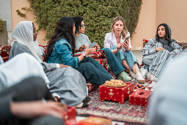 istock Diverse Group Engaged in Discussion in Arabian Majlis 2219707201