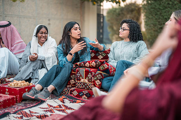 istock Diverse Women Engaging in Lively Arabian Majlis Gathering 2219707220