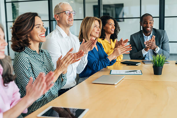 istock Diverse Team Applauding During a Business Presentation 2219710496
