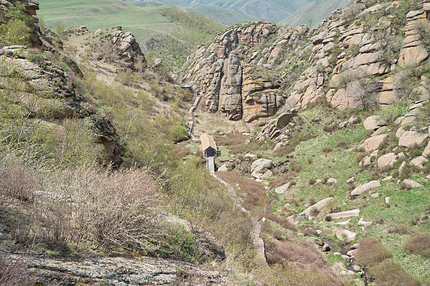 istock Scenic Mountain Valley with Lush Greenery and Rugged Rocks 2219719022