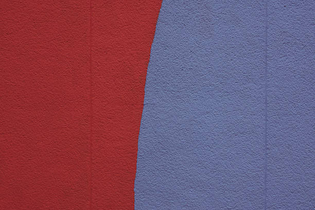 The background for the design is a wall painted in blue and red.