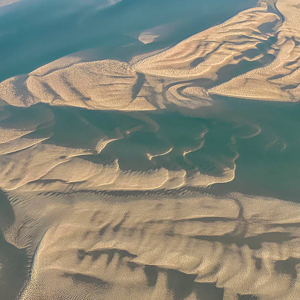 istock Exposed Textured Sand in the Sea 2219724555